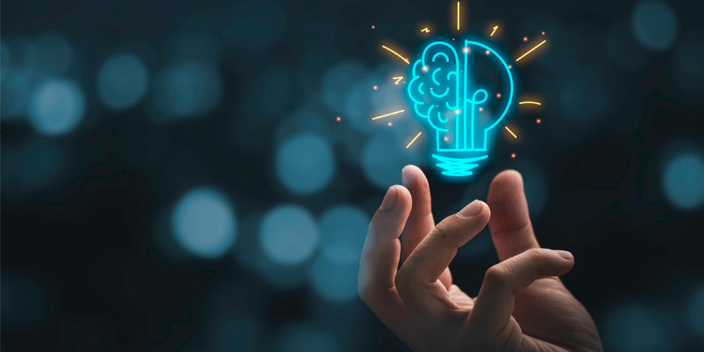 Oracle Infrastructure transformation Hand holding drawing virtual lightbulb with brain on bokeh background for creative and smart thinking idea concep